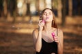 Portrait of pretty woman with bubbles, traveler relaxing in forest.