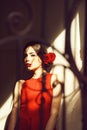 Portrait of pretty woman with red lips and rose flower Royalty Free Stock Photo