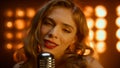 Portrait woman singing microphone in nightclub lights. Lady performing indoor.