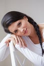 Portrait Of Pretty Woman Sitting In Chair Indoors Royalty Free Stock Photo