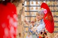 Portrait of pretty woman wear japanese style dress and hold red umbrella during attractive on wood banner in front of row of Royalty Free Stock Photo