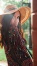 Portrait of pretty woman wearing dress and straw hat in sunny warm weather day Royalty Free Stock Photo