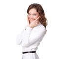 Portrait of pretty young businesswoman with hand on chin and smiling