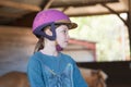 portrait of a pretty young girl during a horse riding lesson Royalty Free Stock Photo