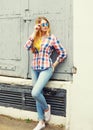 Portrait pretty young girl wearing a checkered shirt and sunglasses Royalty Free Stock Photo