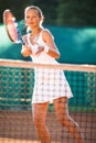 Portrait of a pretty young tennis player at play Royalty Free Stock Photo