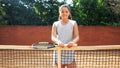 Portrait of pretty young tennis playgirl standing with racket. Royalty Free Stock Photo