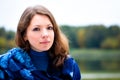 Portrait of pretty young woman against forest Royalty Free Stock Photo