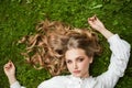 Portrait of pretty young woman on green grass outdoors Royalty Free Stock Photo