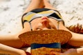 Portrait of a pretty young woman having sunbath on the beach