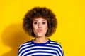 Portrait of pretty young woman pouted lips kiss wear striped shirt isolated on yellow color background