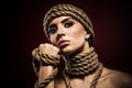 Portrait of a pretty young woman with ropes Royalty Free Stock Photo