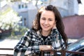 Portrait of pretty young woman smiling happily relaxing outdoors on spring sunny day Royalty Free Stock Photo