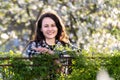 Portrait of pretty young woman smiling happily relaxing outdoors on spring sunny day Royalty Free Stock Photo