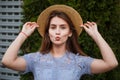 Portrait pretty young woman in summer hat blowing lips kiss outdoor Royalty Free Stock Photo