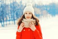 Portrait pretty young woman wearing jacket and hat in winter day Royalty Free Stock Photo