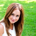 Portrait of prety smiling young woman outdoors