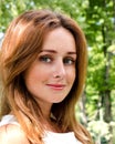 Portrait of prety smiling young woman outdoors