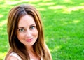 Portrait of prety smiling young woman outdoors