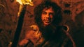 Portrait of Primeval Caveman Wearing Animal Skin Standing in His Cave At Night, Holding Torch with