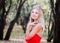 Portrait of princess in crown and red dress in forest. Autumn Royalty Free Stock Photo