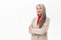 Portrait of professional asian senior businesswoman, cross arms on chest, looking confident, wearing stylish suit Royalty Free Stock Photo