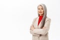 Portrait of professional asian senior businesswoman, cross arms on chest, looking confident, wearing stylish suit Royalty Free Stock Photo