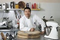 Portrait of a professional Chinese chef in a white uniform in a professional kitchen. Restaurant, professional concept