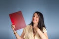 Portrait of professional female lawyer showing flyer from her office Royalty Free Stock Photo