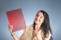 Portrait of professional female lawyer showing flyer from her office Royalty Free Stock Photo