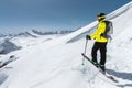 Portrait of a professional freerider skier standing on a snowy slope against the background of snow-capped mountains Royalty Free Stock Photo