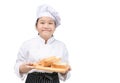 Portrait of a professional girl chef show bread on wood plate isolated on white background. bakery and baker Royalty Free Stock Photo