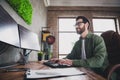 Portrait of professional hacker young man write keyboard computer desk loft interior office indoors Royalty Free Stock Photo