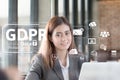 Portrait of an professional investment advisor businesswoman sitting in front of laptop at her desk while looking at camera. Royalty Free Stock Photo