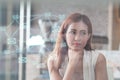 Portrait of an professional investment advisor businesswoman sitting in front of laptop at her desk while looking at camera and Royalty Free Stock Photo