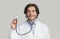 Portrait of professional male doctor holding stethoscope, ready to examine patient Royalty Free Stock Photo