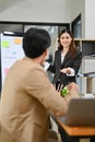 Portrait, Professional Asian female manager leads the meeting, sharing ideas with her team Royalty Free Stock Photo