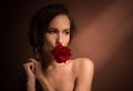 Portrait of professional model girl with red rose