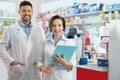 Portrait of professional pharmacists in drugstore