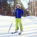 Portrait of professional skier boy dressed in sportswear