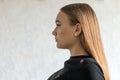 Portrait in profile of a teenage girl, brunette, european 16 years old, with dark long hair, Royalty Free Stock Photo