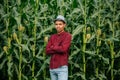 Portrait of a proud african american farmer standing with arms crossed with corn field in background Royalty Free Stock Photo