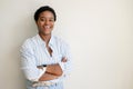 Portrait of proud charismatic stylish african-american woman with short hair standing in confident pose with arms