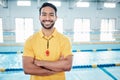 Portrait, proud and coach at a swimming pool for training, exercise and practice at indoor center. Face, happy and