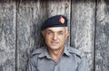 portrait of proud elderly policeman in Peshawar, Pakistan. He likes to pose for tourists and tells proudly about the british