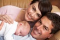 Portrait Of Proud Parents With Newborn Baby