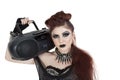 Portrait of punk woman holding boom box on shoulder over white background Royalty Free Stock Photo