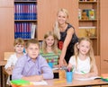 Portrait of pupils and their teacher in a classroom Royalty Free Stock Photo