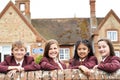 Portrait Of Pupils In Uniform Outside School Building Royalty Free Stock Photo