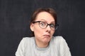 Portrait of puzzled girl looking with bewilderment at camera